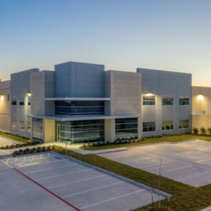 An aerial view of an industrial building at dusk.