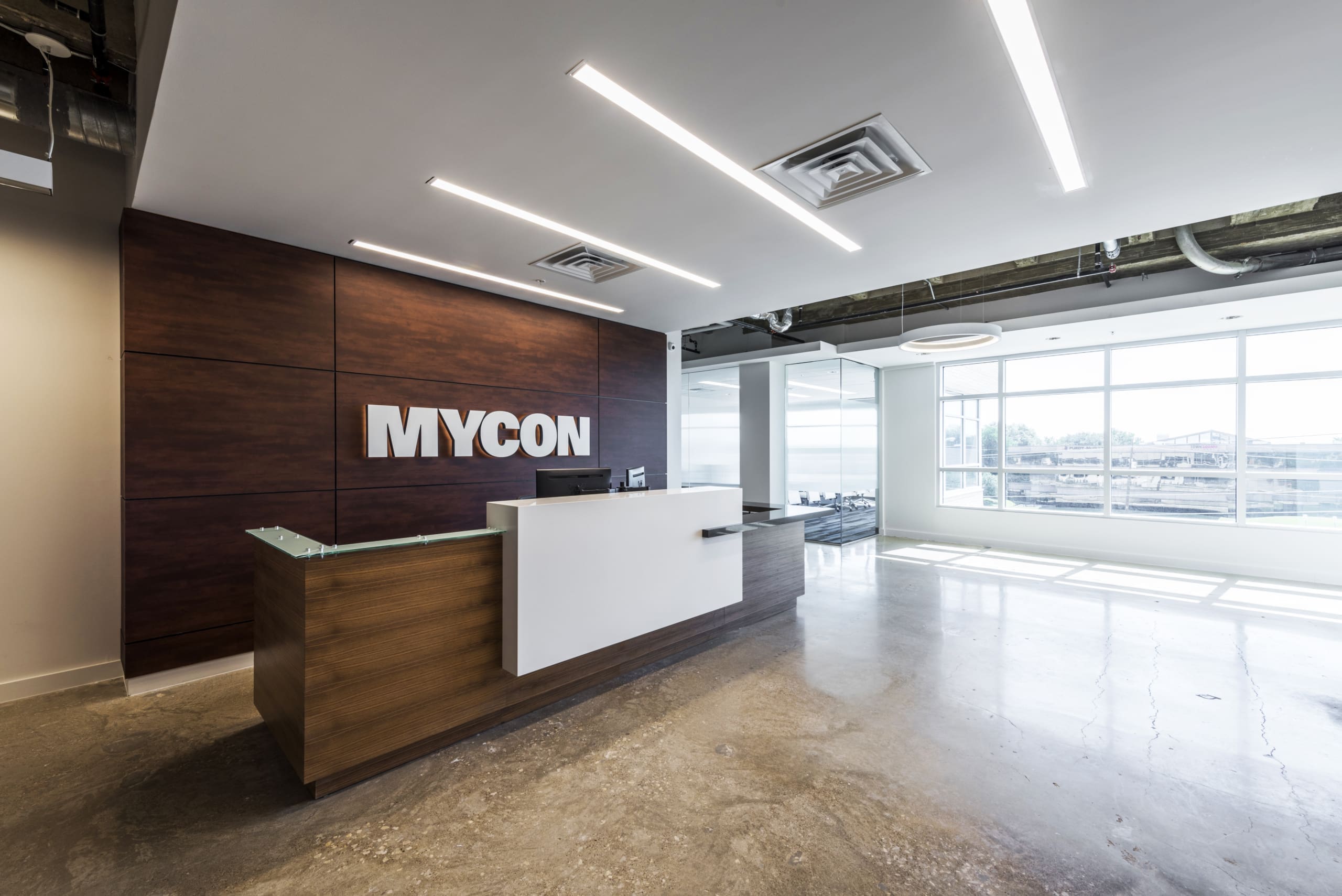 The reception area of an office with the word mycom on it.