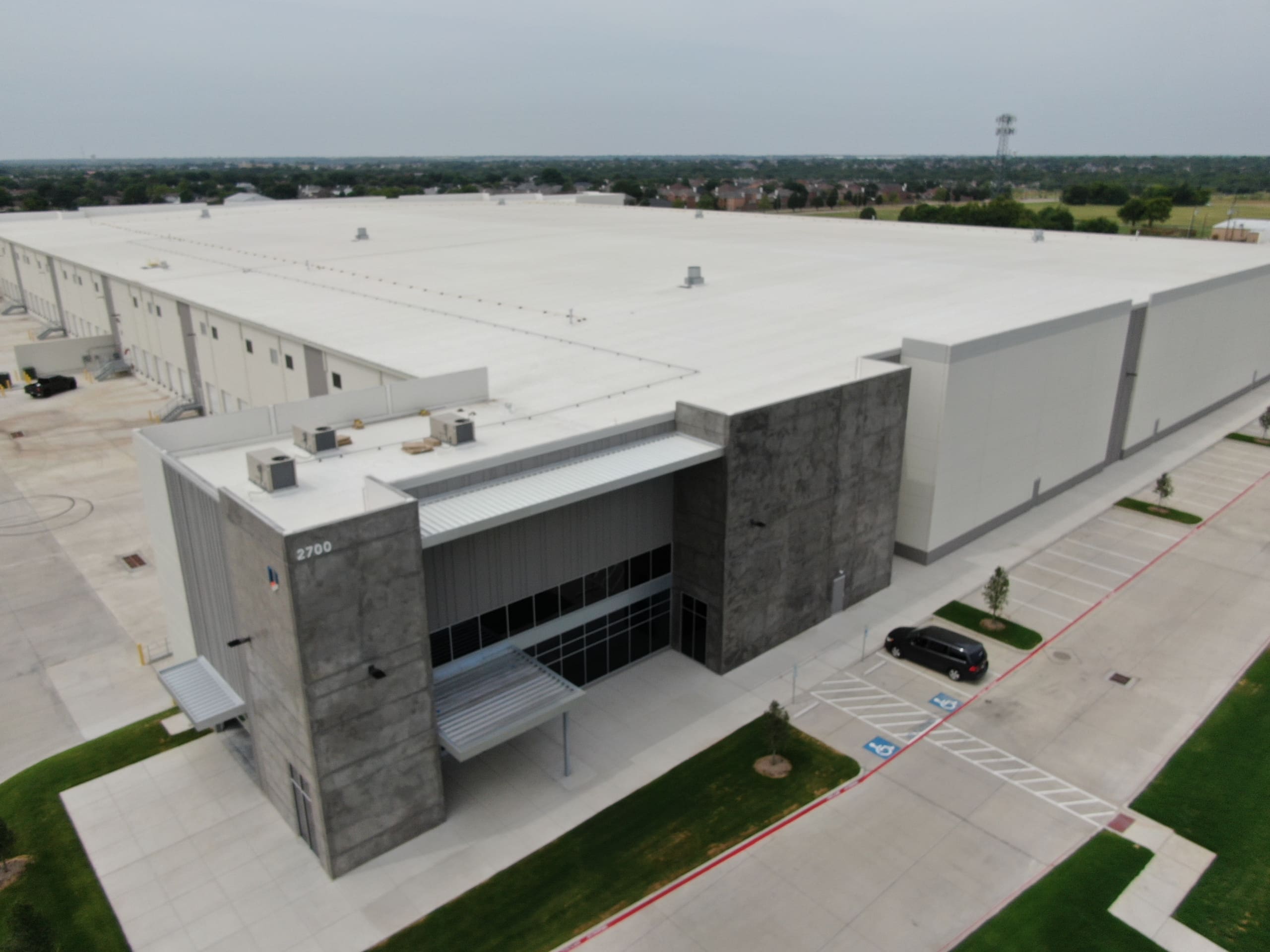 An aerial view of a large warehouse building.