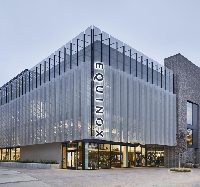 The equinox building is a modern building with a glass facade.