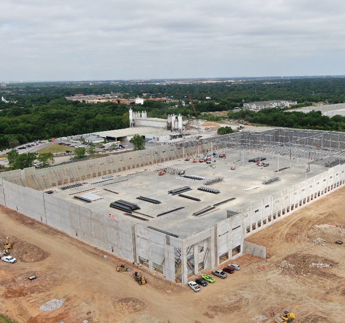 An aerial view of a large building under construction.