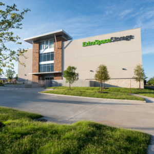A storage building with a grassy area in front of it.