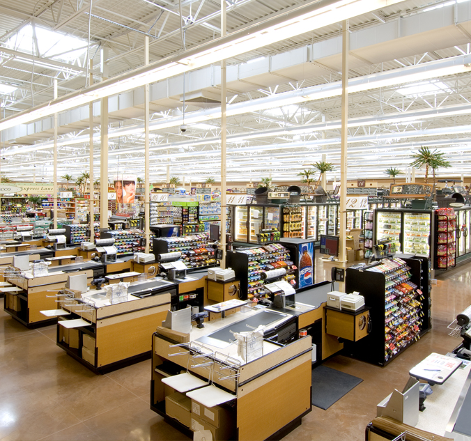 A large grocery store with a lot of counters.