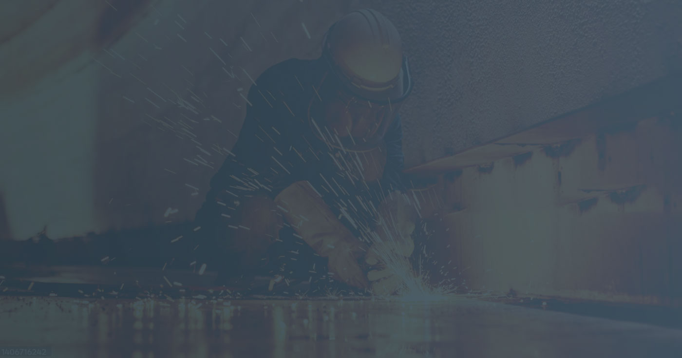 An image of a welder working on a piece of metal.