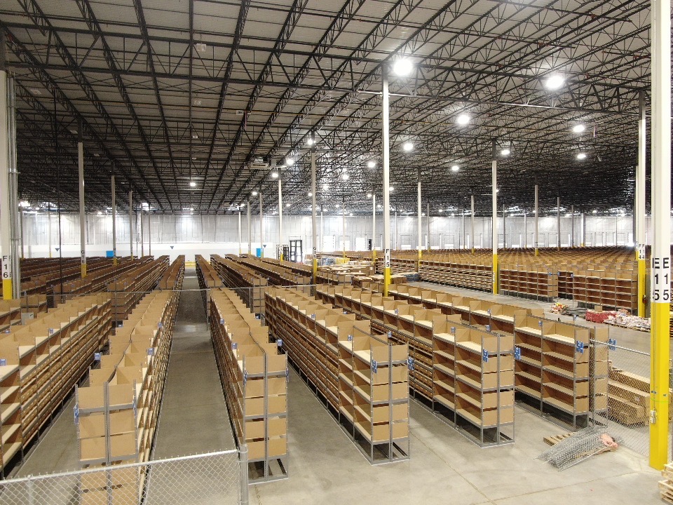 A large warehouse with many rows of shelves.