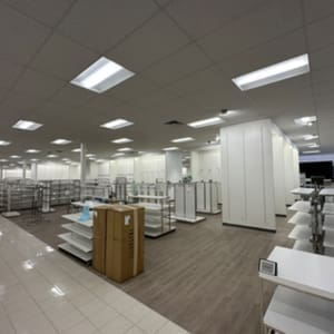 The inside of a store with shelves and shelves.