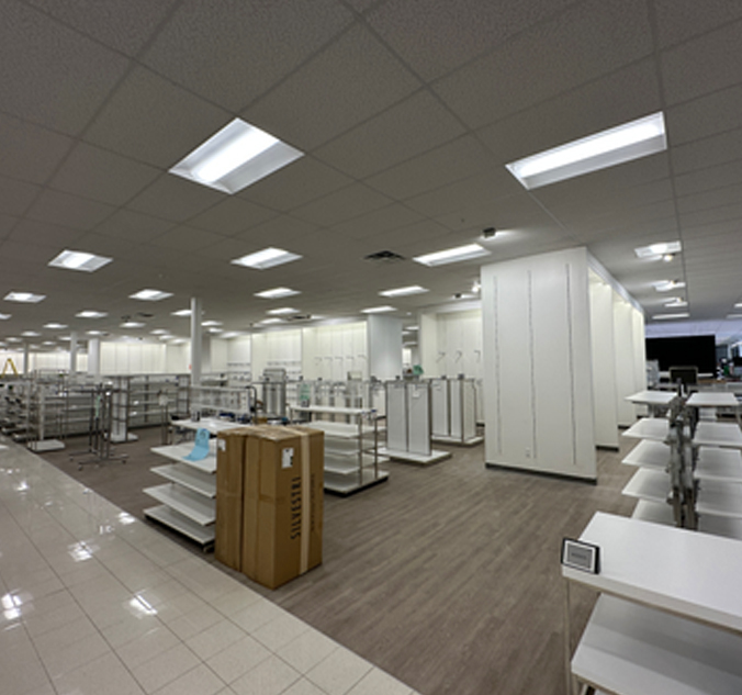 The inside of a store with shelves and shelves.