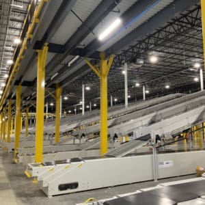 A large warehouse with many conveyor belts.