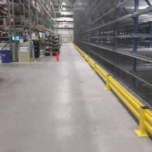 A warehouse with a lot of racks and shelves.