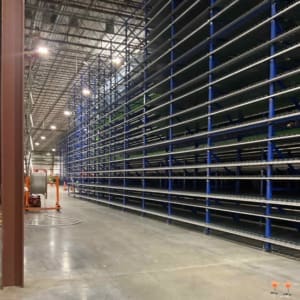 A warehouse with a lot of racks in it.