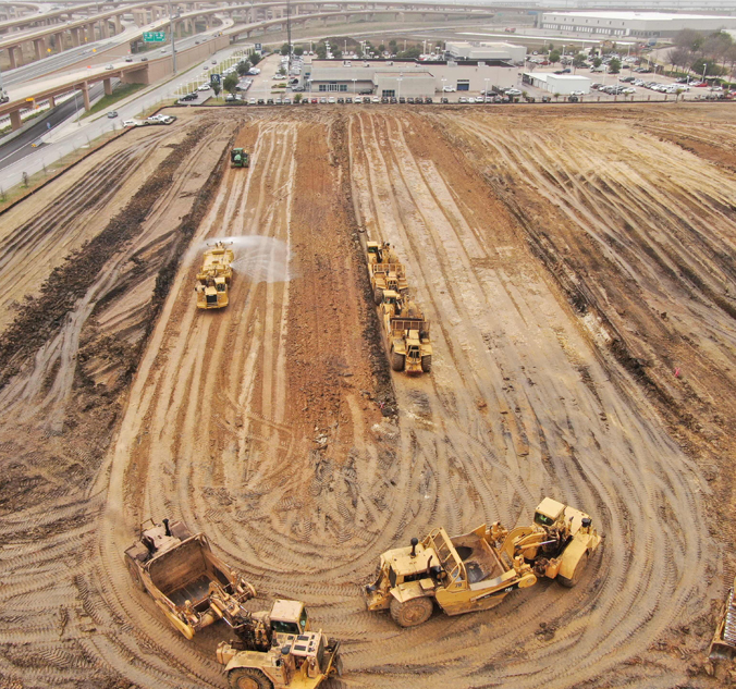 A construction site with several construction vehicles.