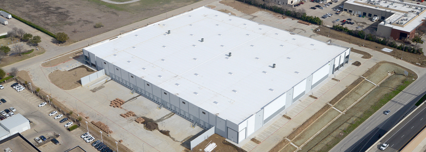 An aerial view of a large white building.