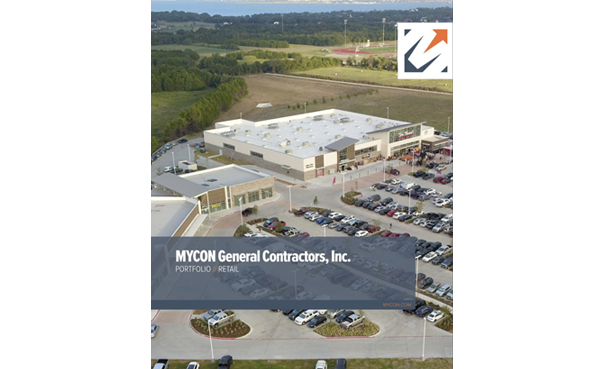 Aerial view of a large retail building with a busy parking lot surrounded by open green land. A MYCON General Contractors, Inc. label is on the image.